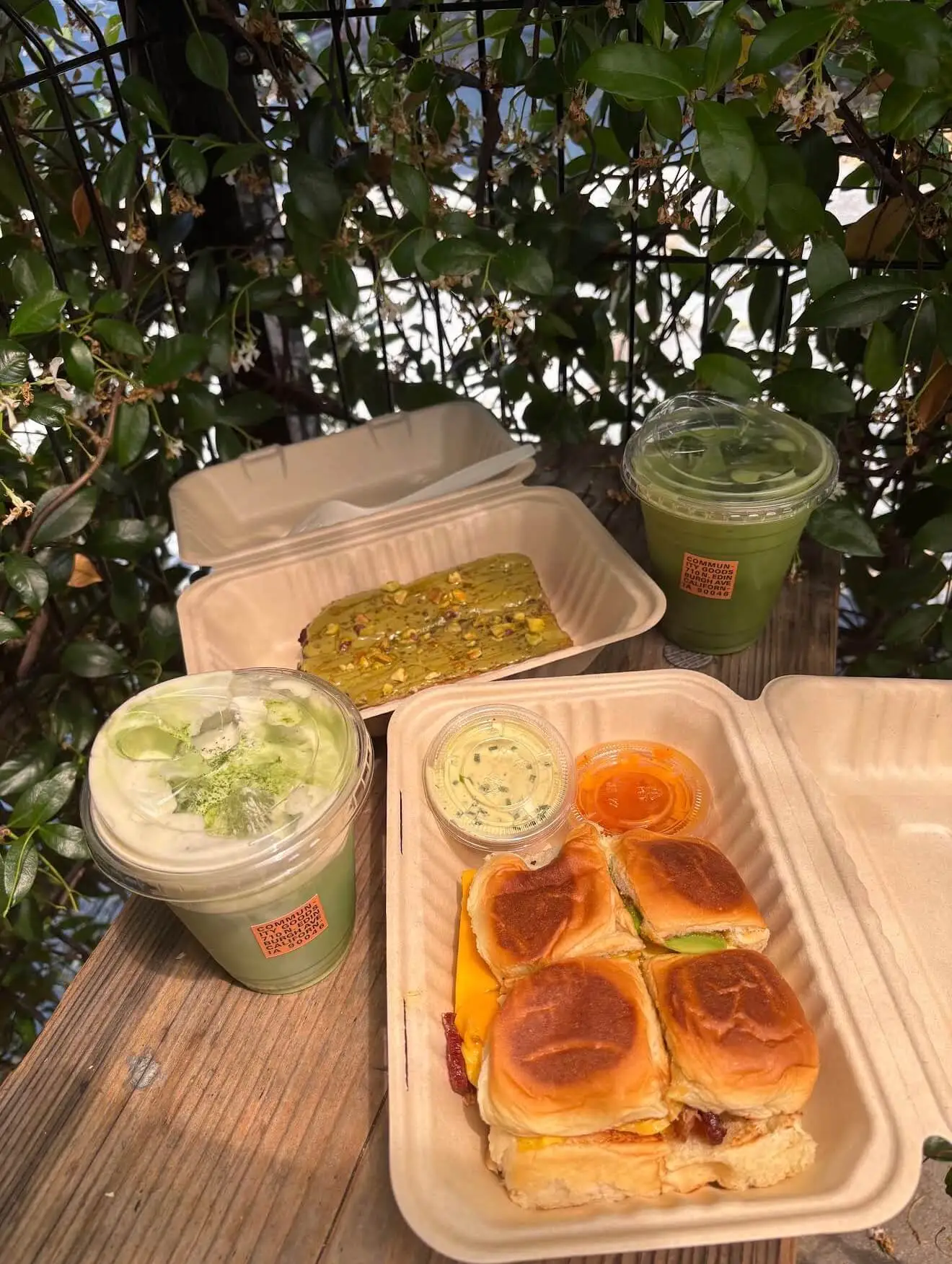 Iced matcha and coffee on the outdoor bench at Community Goods