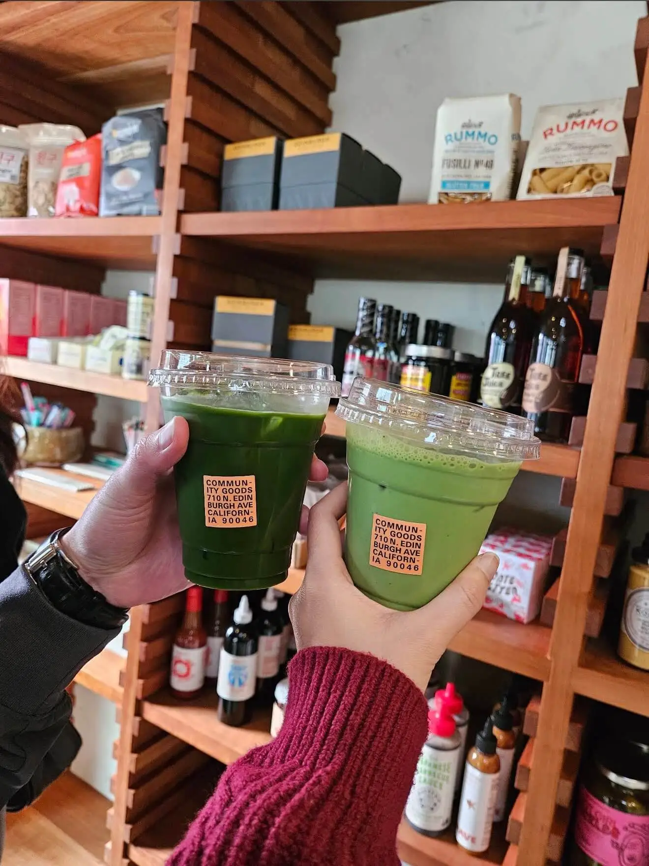 Breakfast order and drinks on the bench outside Community Goods