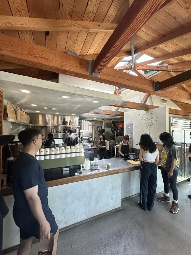 Wooden counter and bench inside the Community Goods cafe