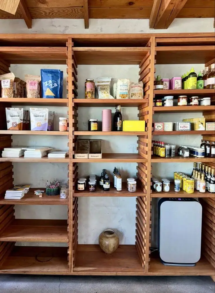 Wood and white wall detail inside Community Goods