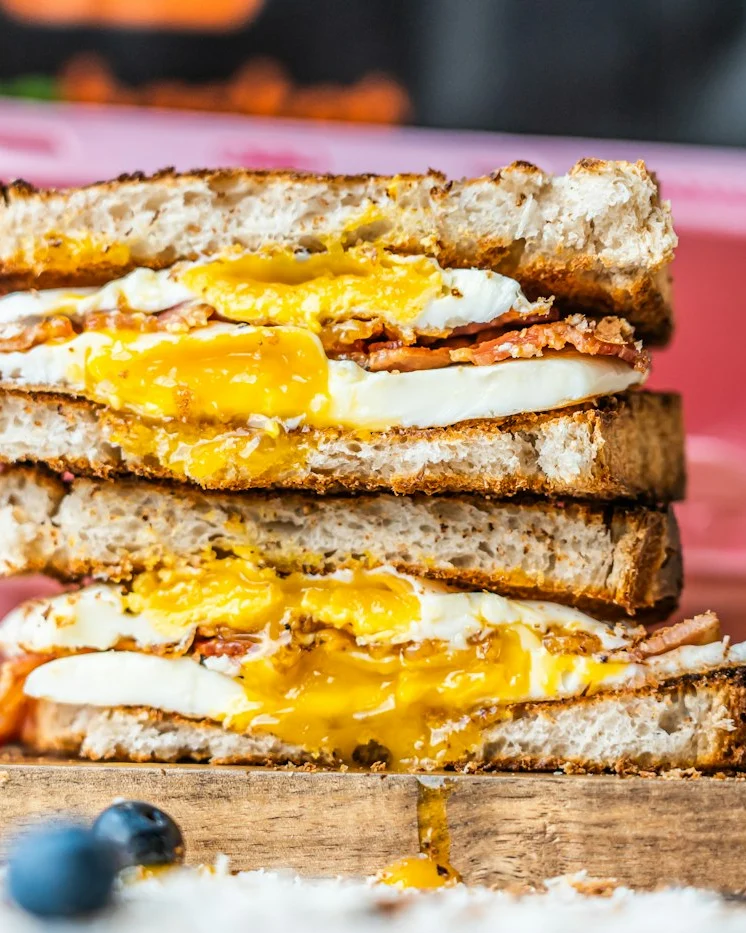 Stack of toasted egg and cheese breakfast sliders